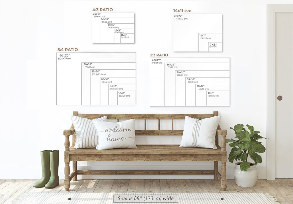 a wooden bench with two white pillows, a potted plant, and a pair of green boots, all set against a white wall with a series of size charts or diagrams displayed above it.